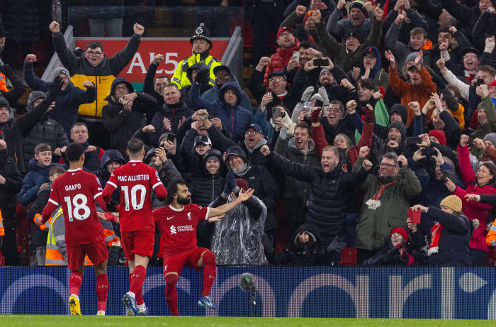 Liverpool's players and supporters pictured celebrating during a 4-2 win over Newcastle in the Premier League in January 2024
